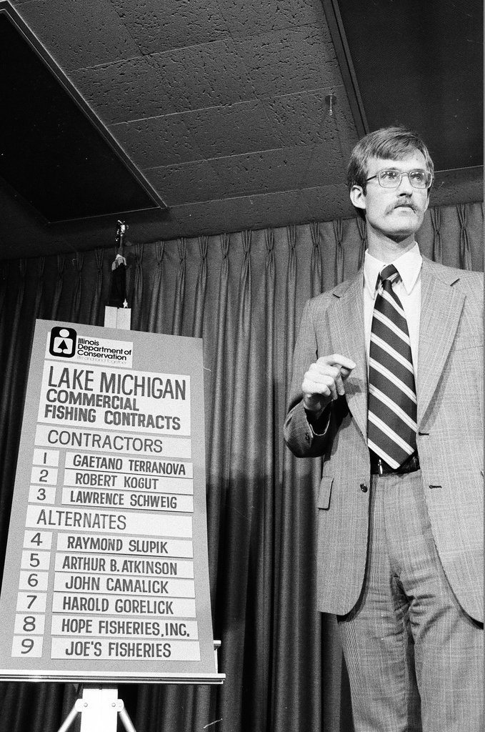 Anthony Dean reads the first numbered ball for the commercial fishing lottery - Chicago Sun-Times