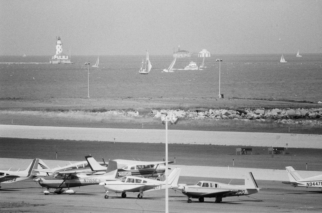 People relax by the lake by the Adler Planetarium - Chicago Sun-Times