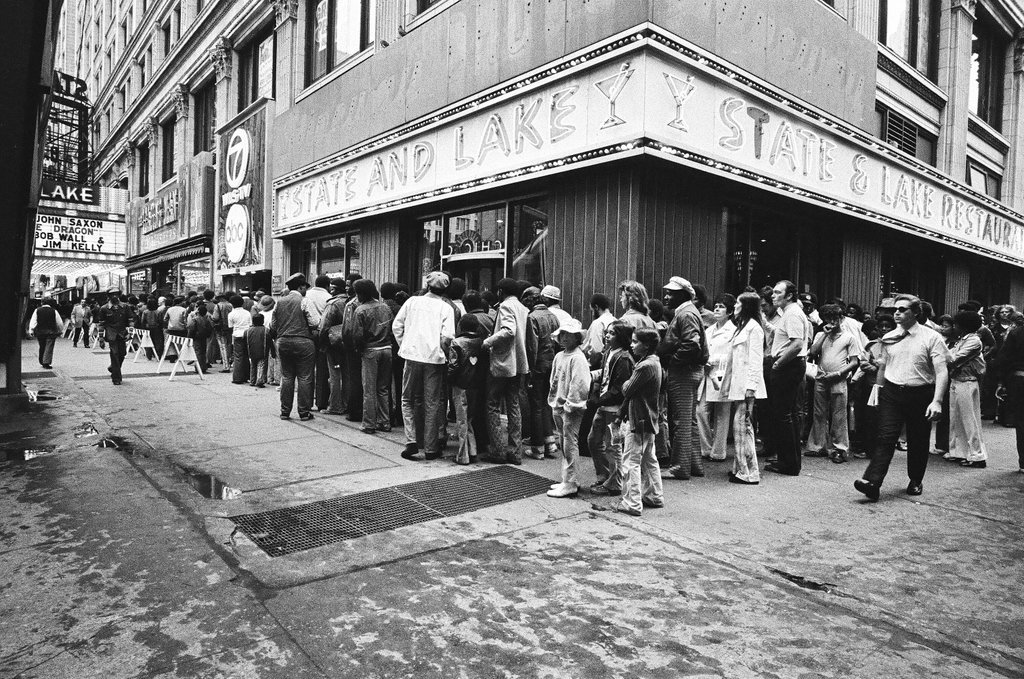 A large crowd waits to buy tickets at the State Lake Theatre - Chicago Sun-Times