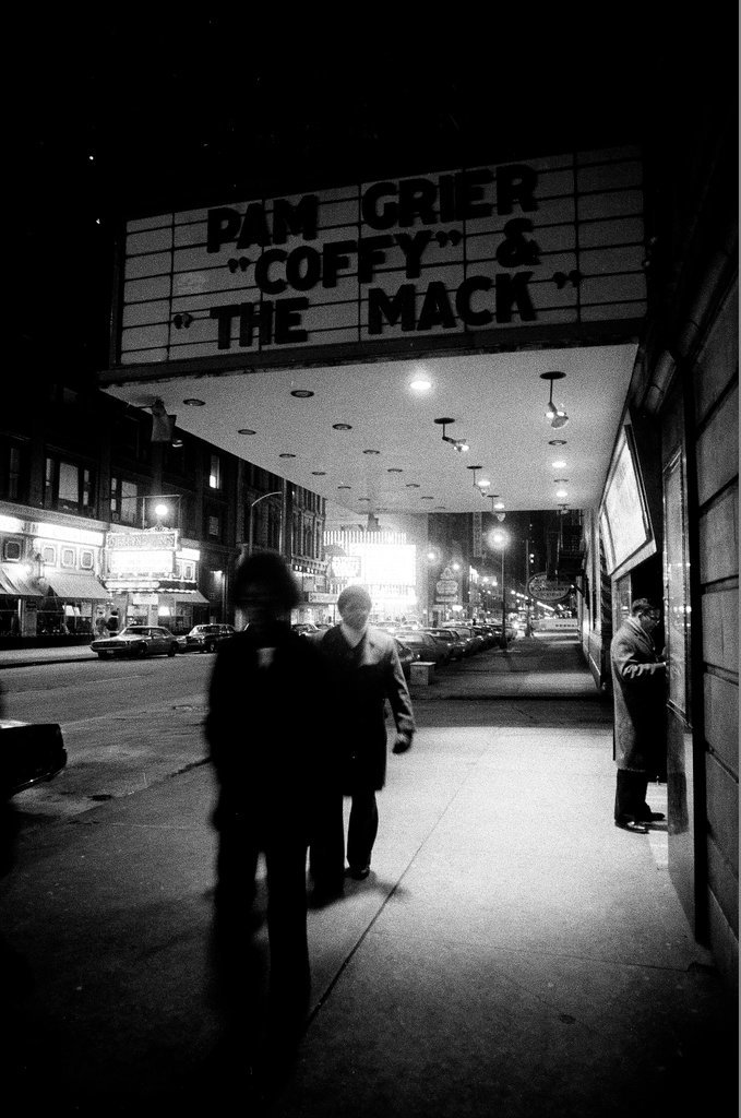 Pedestrians walk by the Michael Todd and State-Lake theaters - Chicago Sun-Times