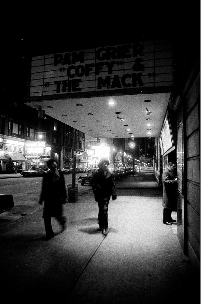Pedestrians walk by the Michael Todd and State-Lake theaters - Chicago Sun-Times