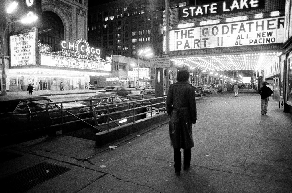 Pedestrians walk by the Michael Todd and State-Lake theaters - Chicago Sun-Times