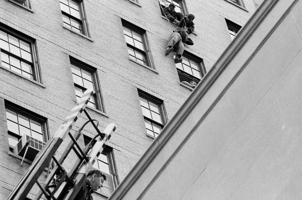 Ray Weich dangles below a twelfth story window while waiting to be rescued - Chicago Sun-Times