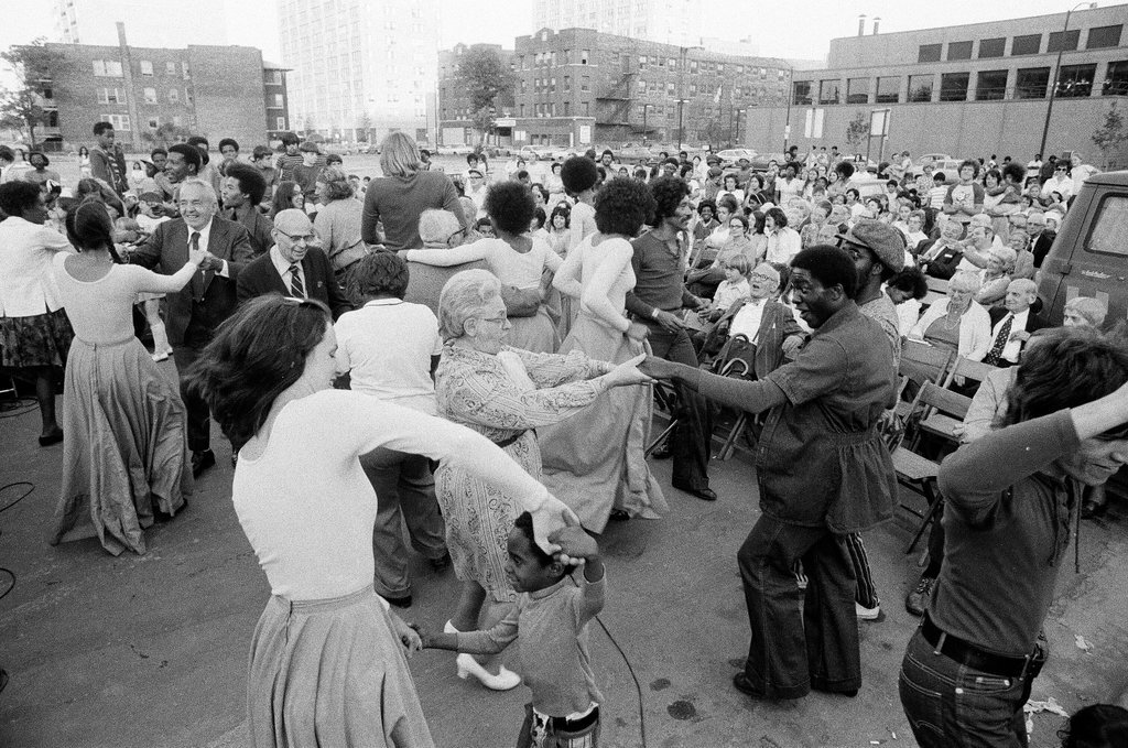 Members of the Free Street Theater Company gather audience members for participation - Chicago Sun-Times