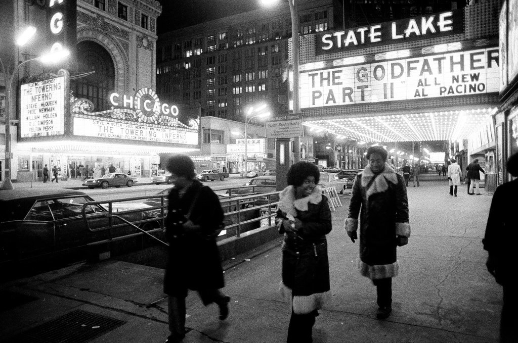 Pedestrians walk by the Michael Todd and State-Lake theaters - Chicago Sun-Times