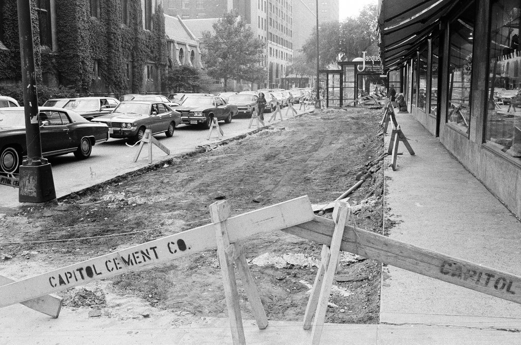The sidewalk at East Delaware Place and North Michigan Avenue is torn up - Chicago Sun-Times