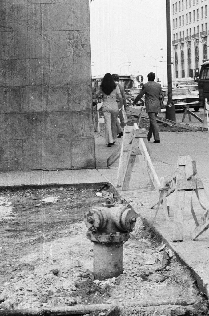 The sidewalk at East Delaware Place and North Michigan Avenue is torn up - Chicago Sun-Times
