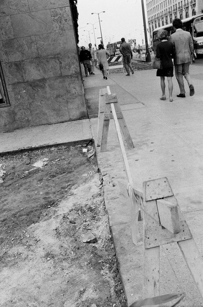 The sidewalk at East Delaware Place and North Michigan Avenue is torn up - Chicago Sun-Times