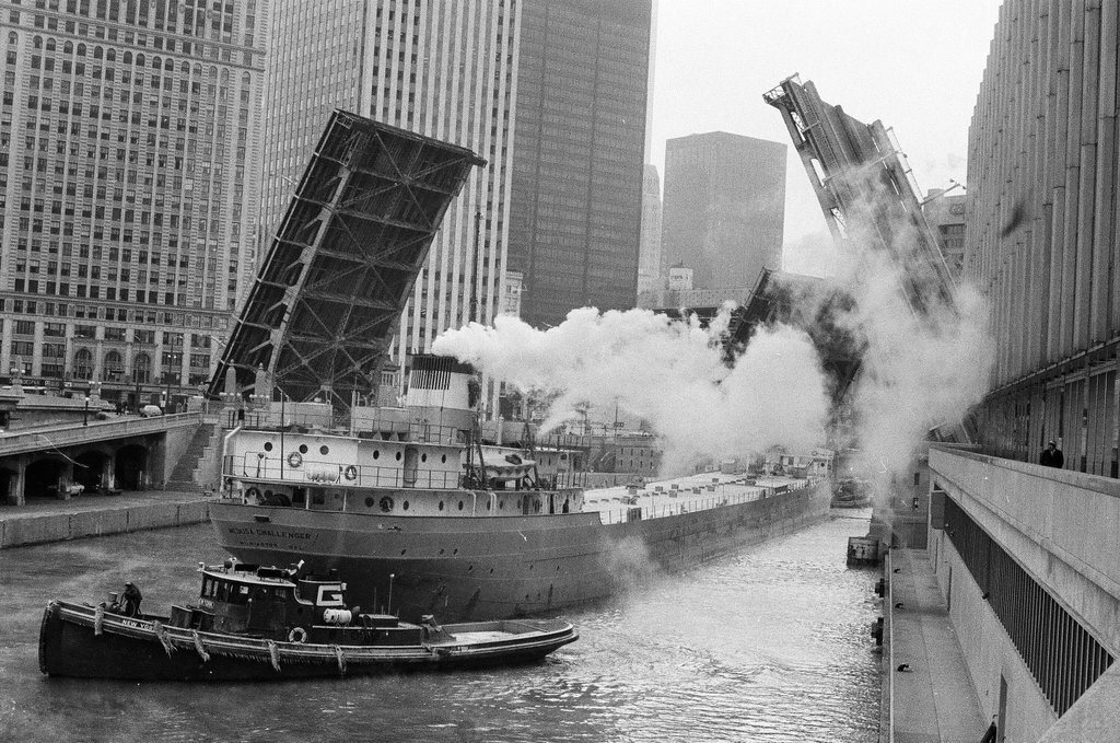 A tug boat tows the Medusa Challenger as it waits for the Wabash Avenue bridge to open - Howard Lyon for Chicago Sun-Times