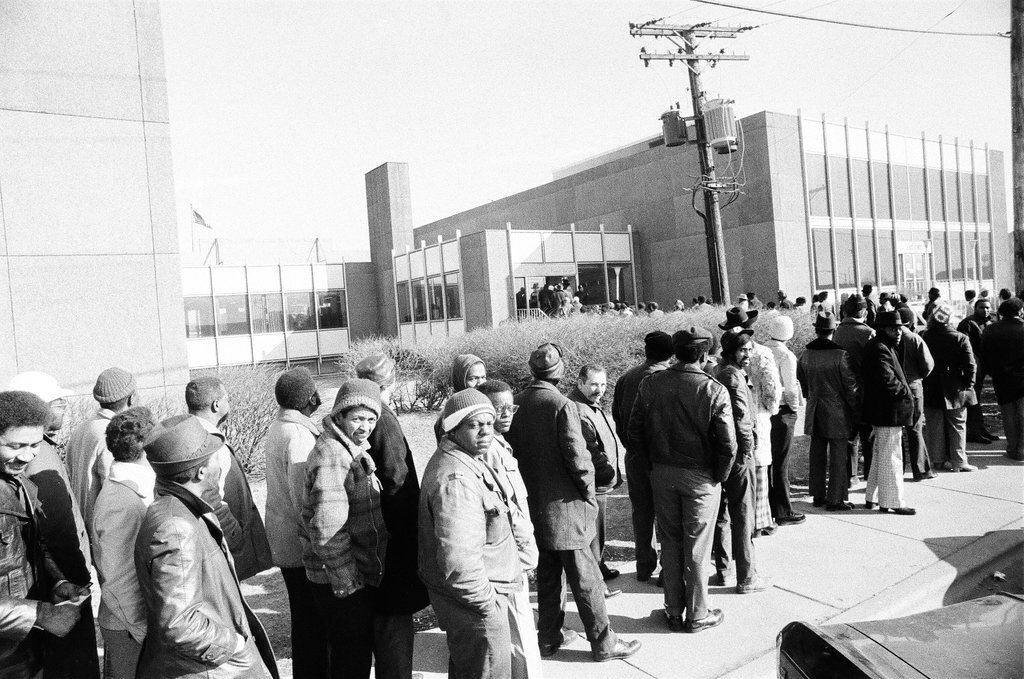 An overflow line forms for people who are collecting auto stickers - Chicago Sun-Times