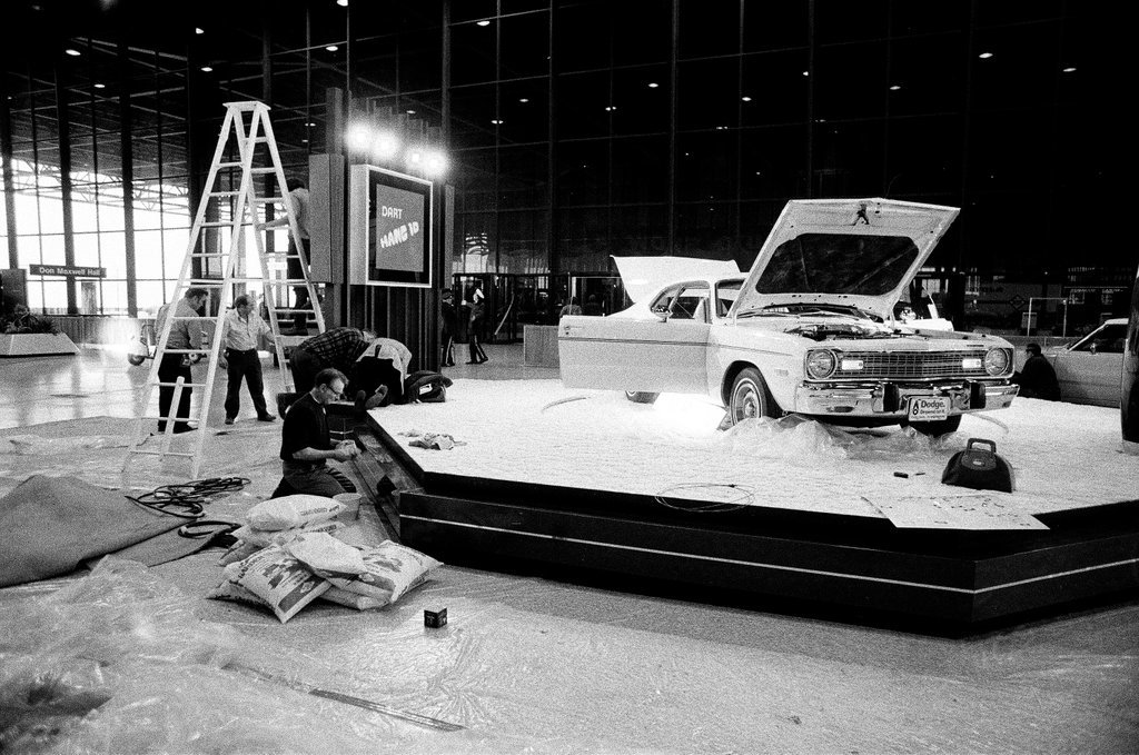 Exhibitors prepare vehicles for display at the 66th Annual Auto Show - Chicago Sun-Times
