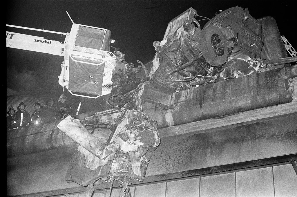Emergency crews recover the remains of a vehicle on the expressway - Chicago Sun-Times