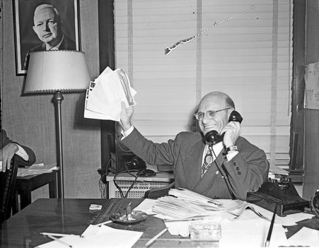 Col. Jacob Arvey, Democratic Party Chairman, receives congratulations by wire and phone at Democratic Headquarters in the Morrison Hotel. RE 1948 election - Chicago Daily News, Inc.