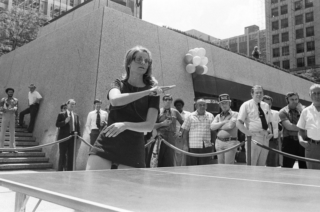 Three table tennis champions challenge individuals from the audience at a table tennis competition - Chicago Sun-Times