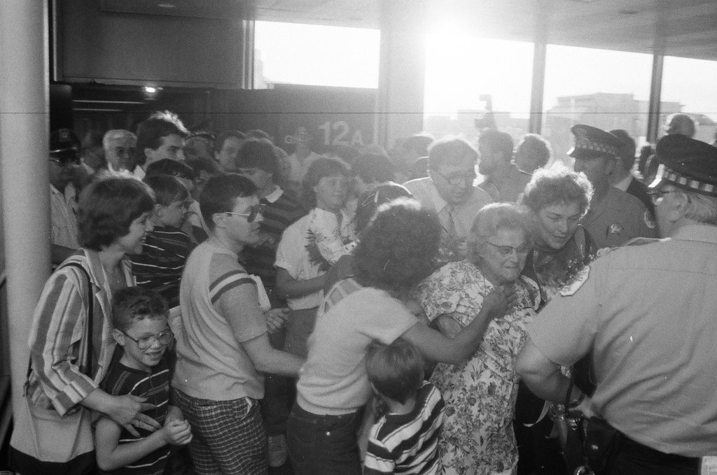 Family and friends await a group of released hostages from Trans World Airlines flight #847 to arrive at O'Hare airport - Chicago Sun-Times