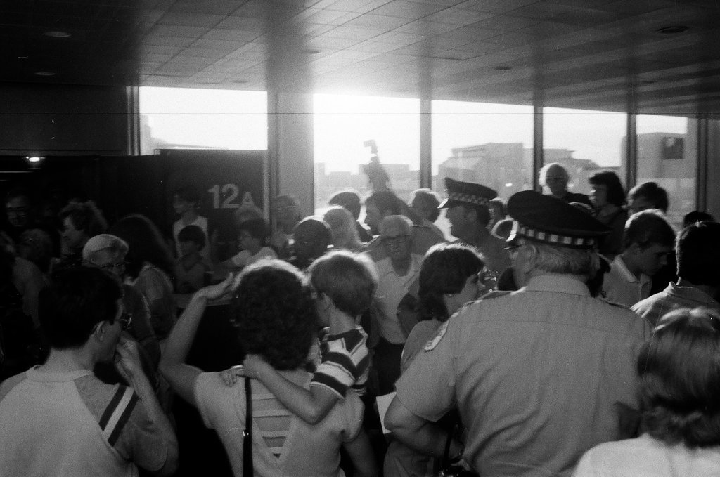 Family and friends await a group of released hostages from Trans World Airlines flight #847 to arrive at O'Hare airport - Chicago Sun-Times