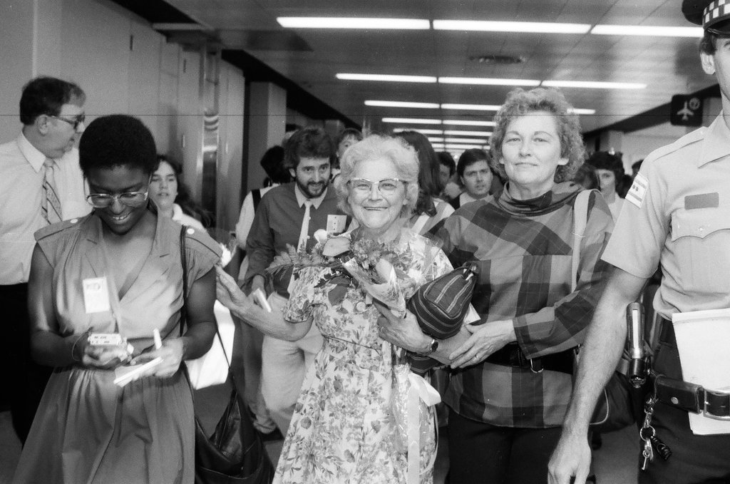 Family and friends await a group of released hostages from Trans World Airlines flight #847 to arrive at O'Hare airport - Chicago Sun-Times