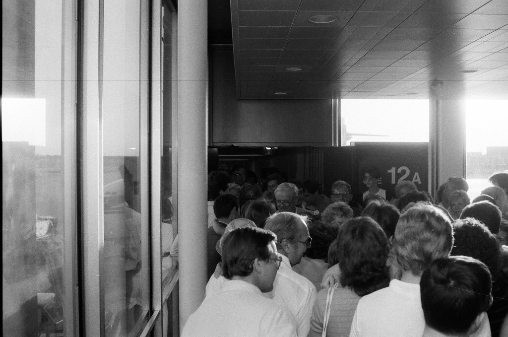 Family and friends await a group of released hostages from Trans World Airlines flight #847 to arrive at O'Hare airport - Chicago Sun-Times