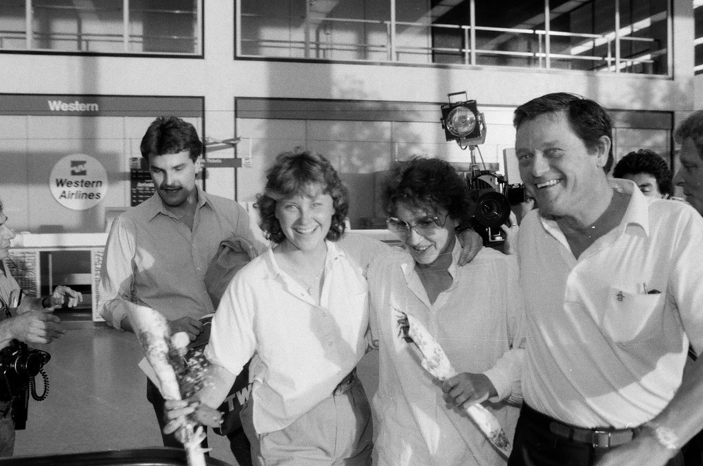 Family and friends await a group of released hostages from Trans World Airlines flight #847 to arrive at O'Hare airport - Chicago Sun-Times