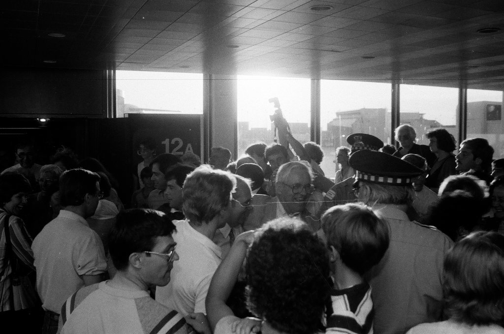 Family and friends await a group of released hostages from Trans World Airlines flight #847 to arrive at O'Hare airport - Chicago Sun-Times