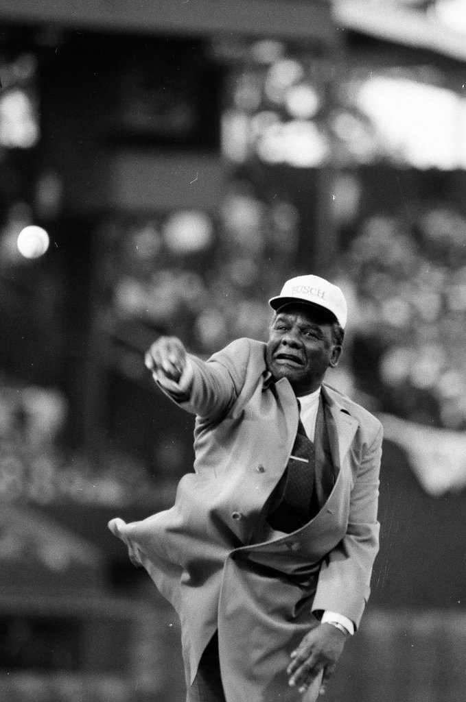 Mayor Harold Washington throws the opening pitch for a baseball game of the Cubs against the White Sox - Chicago Sun-Times