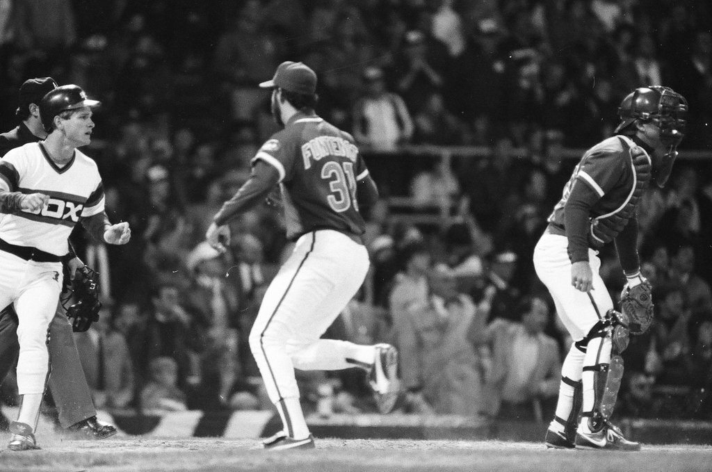 Mayor Harold Washington throws the opening pitch for a baseball game of the Cubs against the White Sox - Chicago Sun-Times