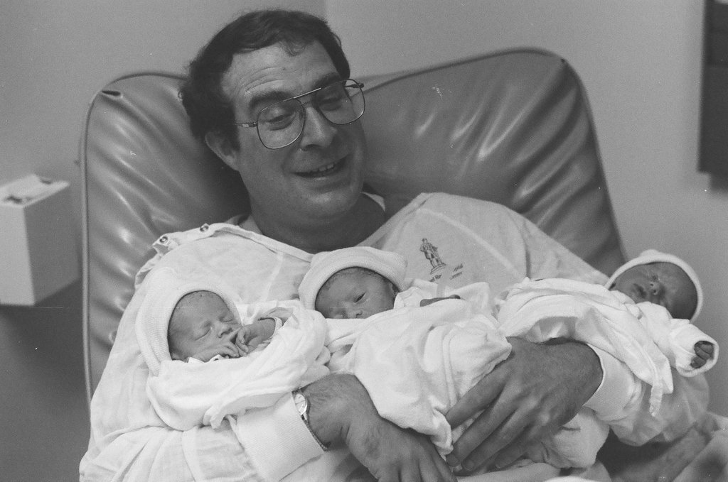 John Cronin holds his newborn triplets at Michael Reese Hospital - Chicago Sun-Times