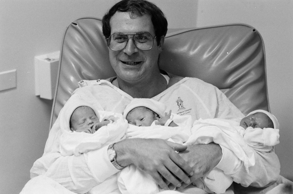 John Cronin holds his newborn triplets at Michael Reese Hospital - Chicago Sun-Times