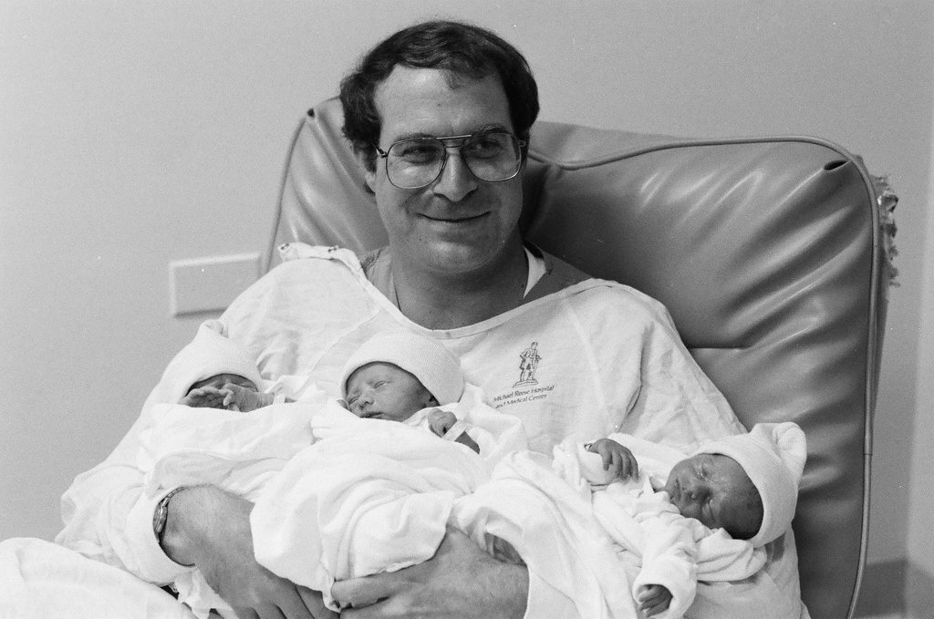 John Cronin holds his newborn triplets at Michael Reese Hospital - Chicago Sun-Times
