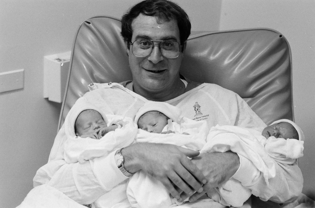 John Cronin holds his newborn triplets at Michael Reese Hospital - Chicago Sun-Times