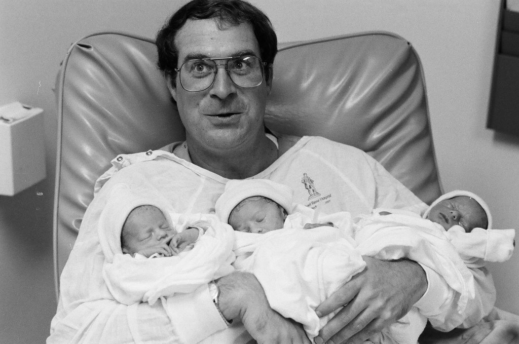 John Cronin holds his newborn triplets at Michael Reese Hospital - Chicago Sun-Times