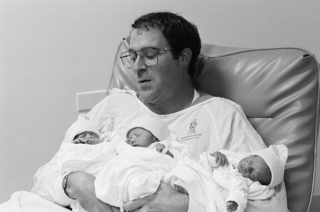 John Cronin holds his newborn triplets at Michael Reese Hospital - Chicago Sun-Times