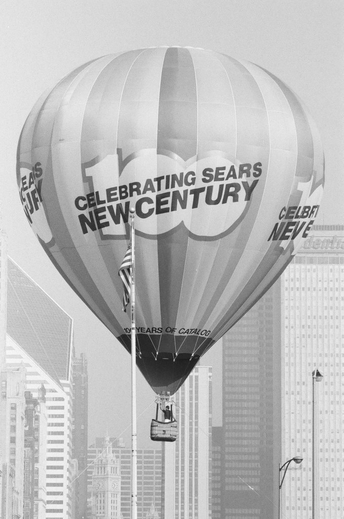 Crowds watch as a hot air balloon lifts off for the Sears 100th anniversary - Chicago Sun-Times