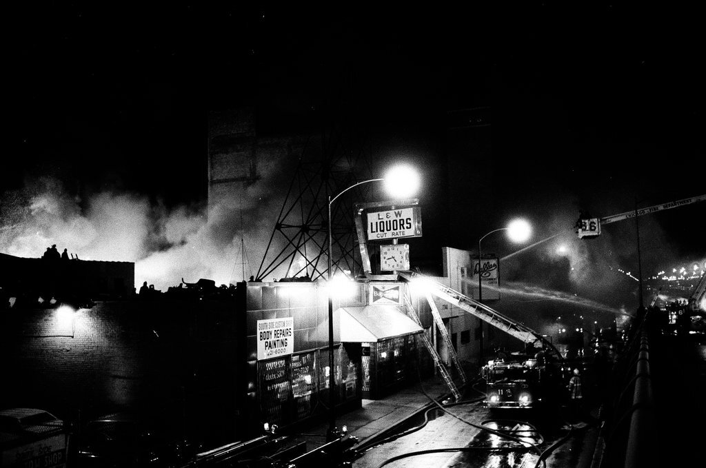 Firefighters battle a fire at a liquor store - Chicago Sun-Times