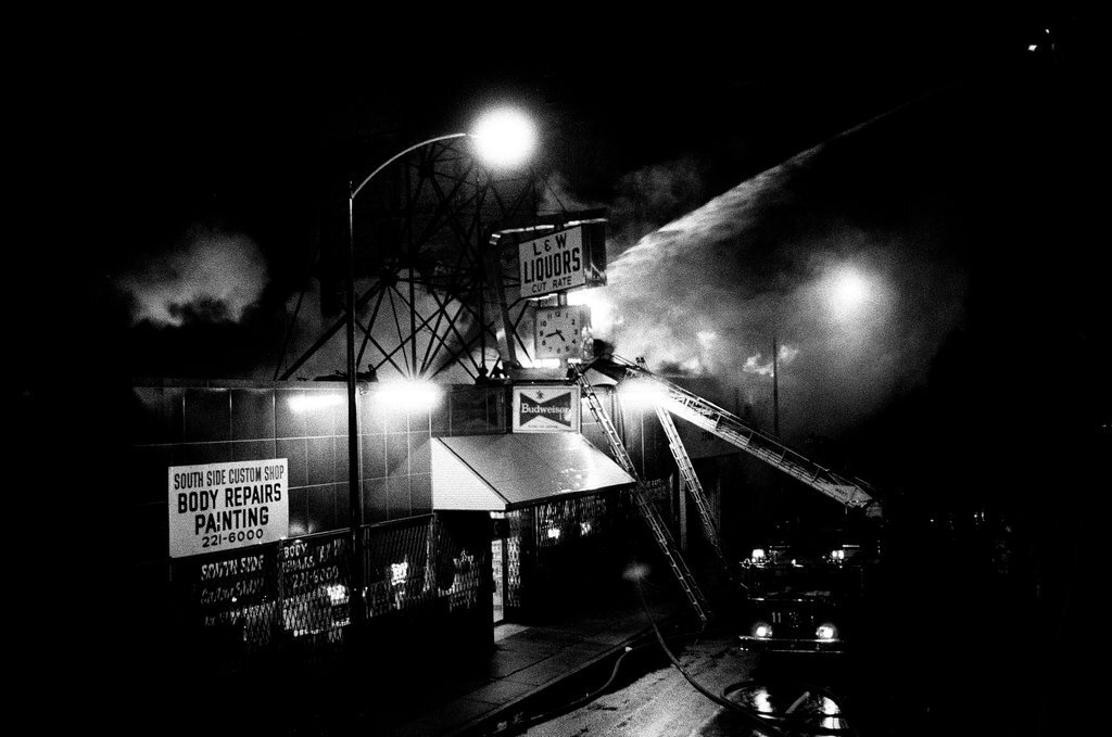 Firefighters battle a fire at a liquor store - Chicago Sun-Times