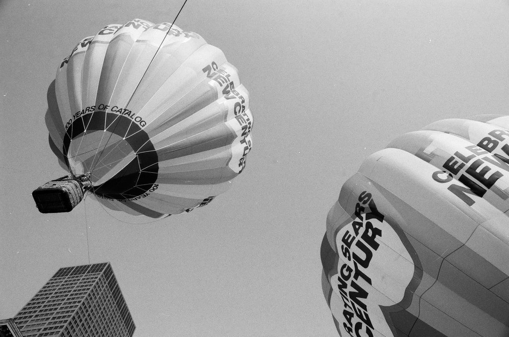 Crowds watch as a hot air balloon lifts off for the Sears 100th anniversary - Chicago Sun-Times