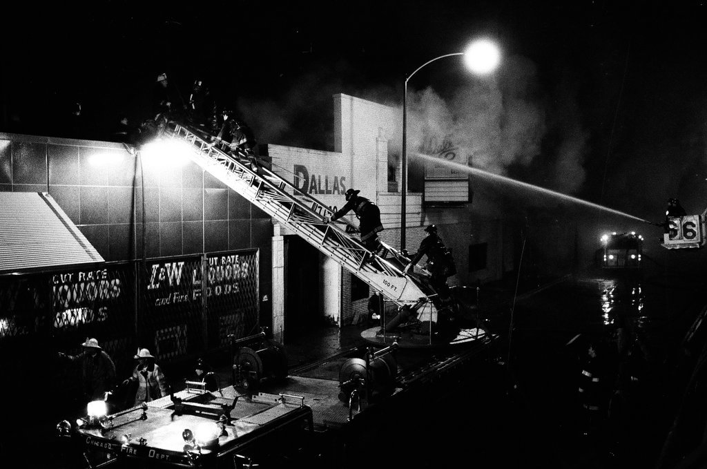 Firefighters battle a fire at a liquor store - Chicago Sun-Times