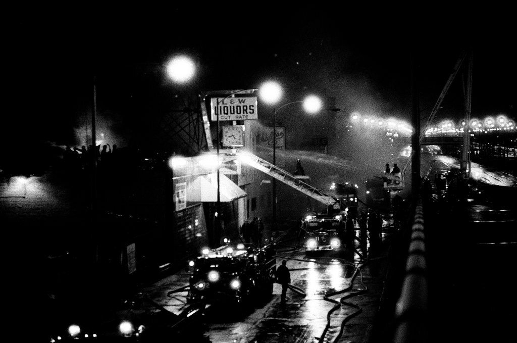 Firefighters battle a fire at a liquor store - Chicago Sun-Times
