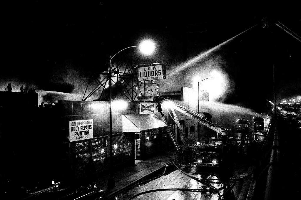 Firefighters battle a fire at a liquor store - Chicago Sun-Times