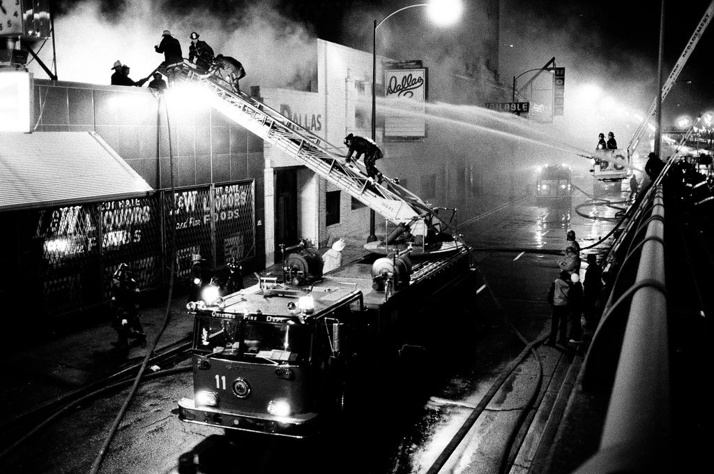 Firefighters battle a fire at a liquor store - Chicago Sun-Times