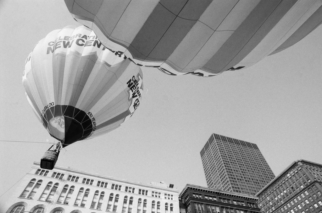 Crowds watch as a hot air balloon lifts off for the Sears 100th anniversary - Chicago Sun-Times