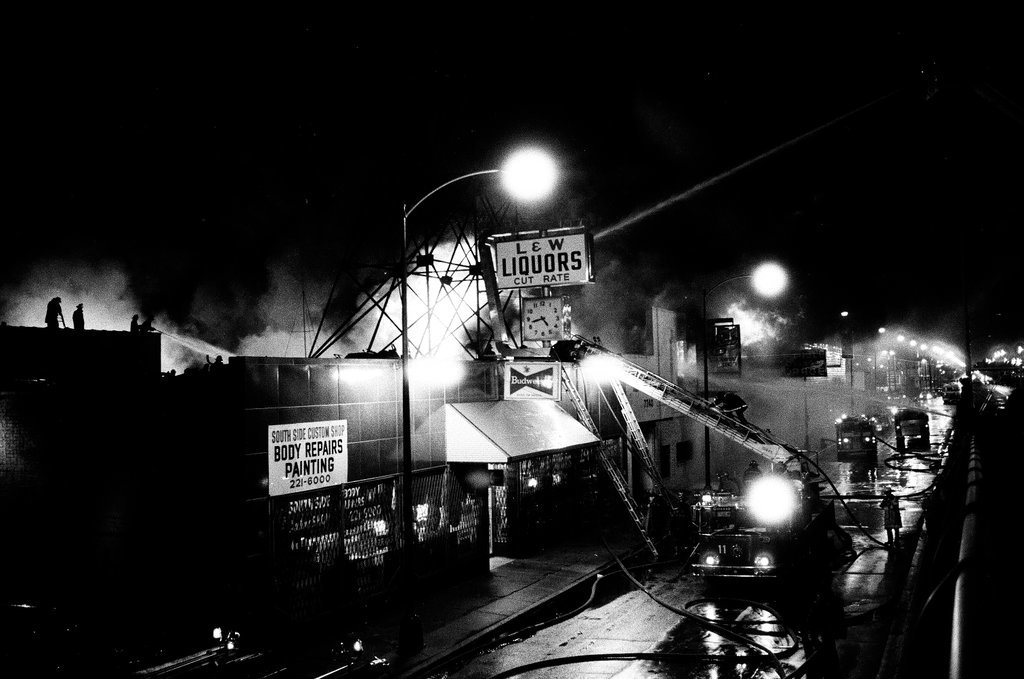 Firefighters battle a fire at a liquor store - Chicago Sun-Times