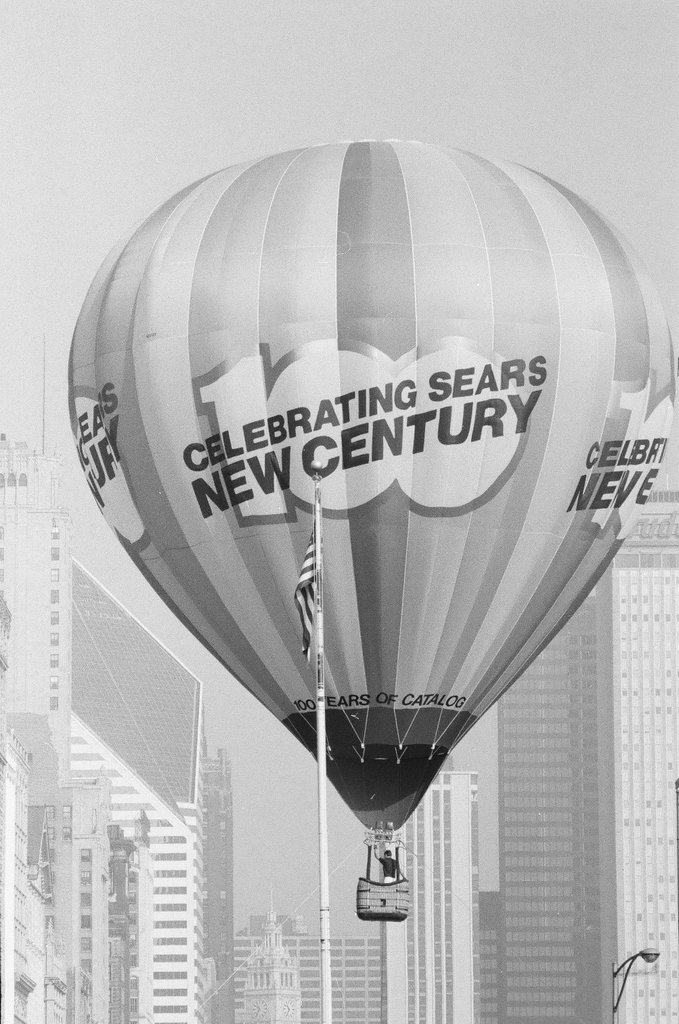 Crowds watch as a hot air balloon lifts off for the Sears 100th anniversary - Chicago Sun-Times