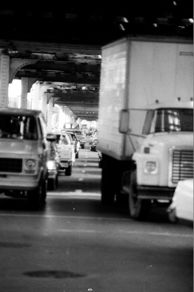 A freight truck is wedged underneath the 