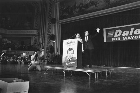Image of Richard M. Daley on stage with his wife, Maggie, during a campaign rally during the Democratic mayoral primary season. - Gordon, Richard