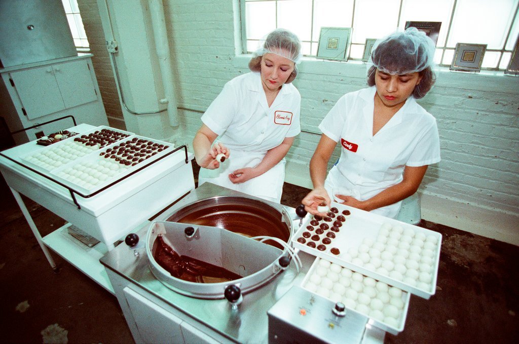 Employees at Fannie May Candies share the production process of truffles - Chicago Sun-Times
