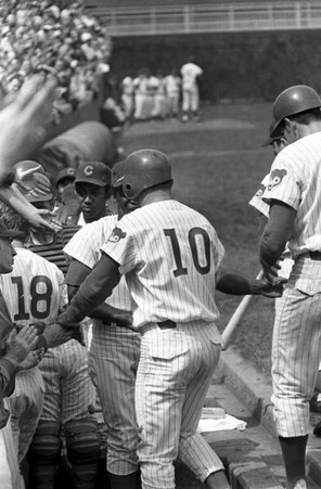 Chicago Cubs player Ron Santo heads to the dugout after scoring a grandslam home run in the sixth inning during a game against the Houston Astros at Wrigley Field. Frame #8 on strip. - Gary Settle for Chicago Sun-Times
