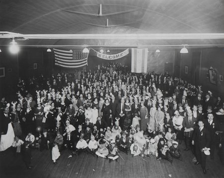 Large group of people celebrating Purim at the Jewish People's Institute (JPI). - Unknown