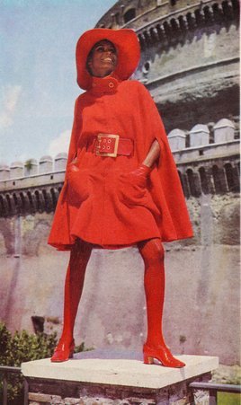 Image of a woman modeling a red Clara Centinaro cape-culotte coat dress