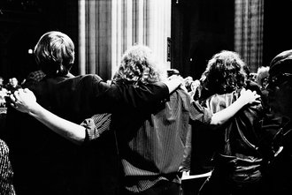Three men embracing, Vietnam Moratorium - Haun, Declan, 1937-1994